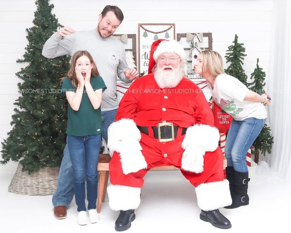 Dad was not happy with mommy trying to kiss Santa